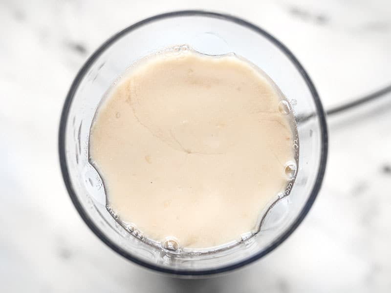 Pureed white beans in a blender, from above.