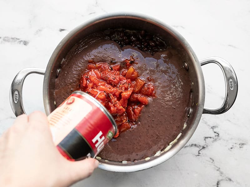 Add fire roasted diced tomatoes to soup pot