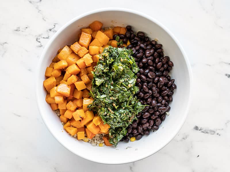 Butternut squash black beans and dressing in bowl