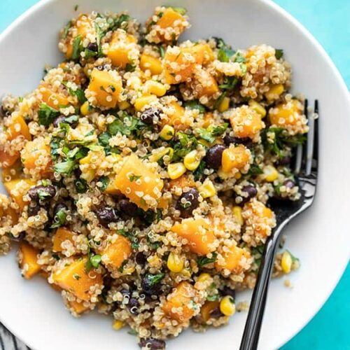 Close overhead view of a bowl full of Chipotle Butternut Squash and Quinoa Salad