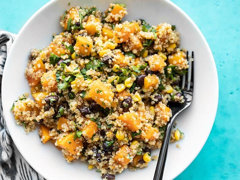 Close overhead view of a bowl full of Chipotle Butternut Squash and Quinoa Salad