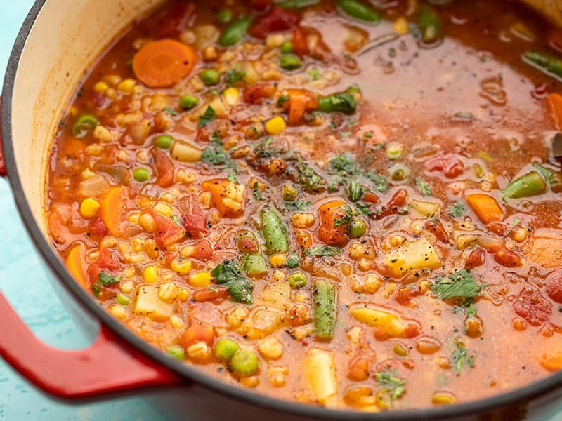 Close up side view of Vegetable Barley Soup in the soup pot