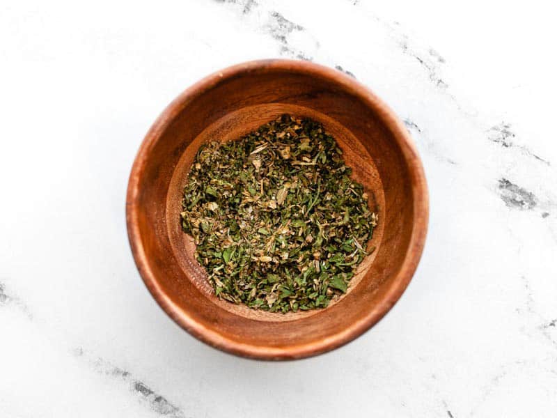 all-purpose garlic herb seasoning in a small wooden bowl