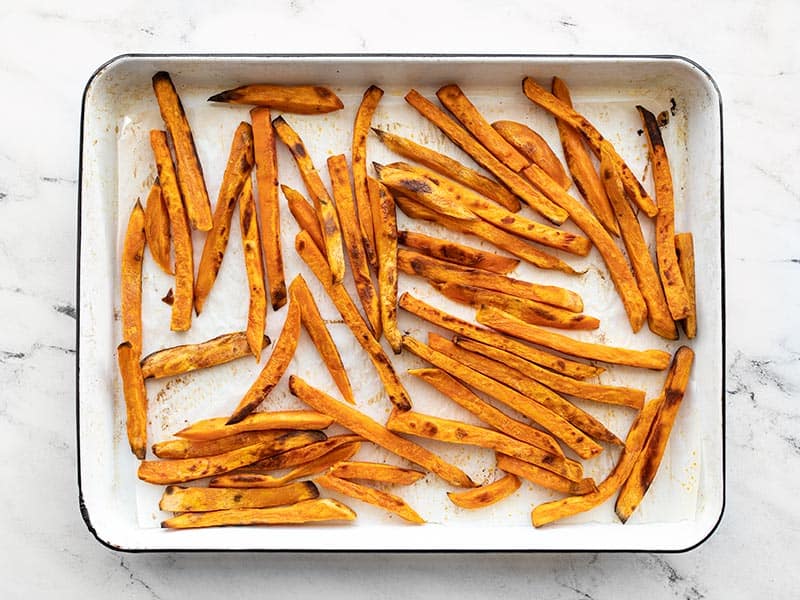 Baked sweet potato fries on the baking sheet