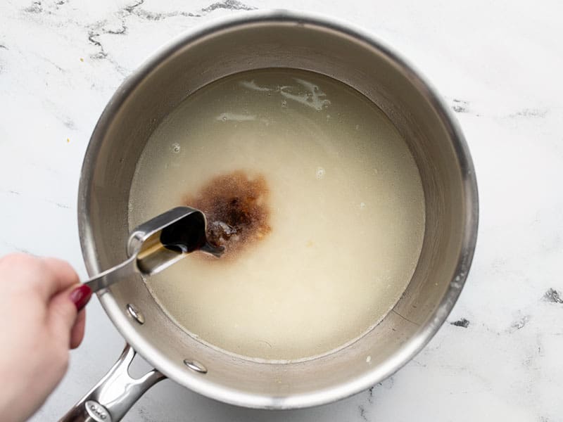 Soy sauce being added to the pot