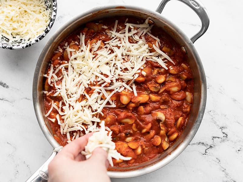 Add shredded mozzarella to the skillet