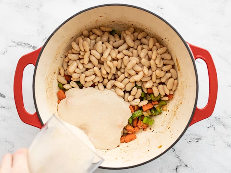 Whole and pureed beans added to soup pot