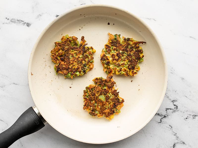 Cooked fritters in a skillet