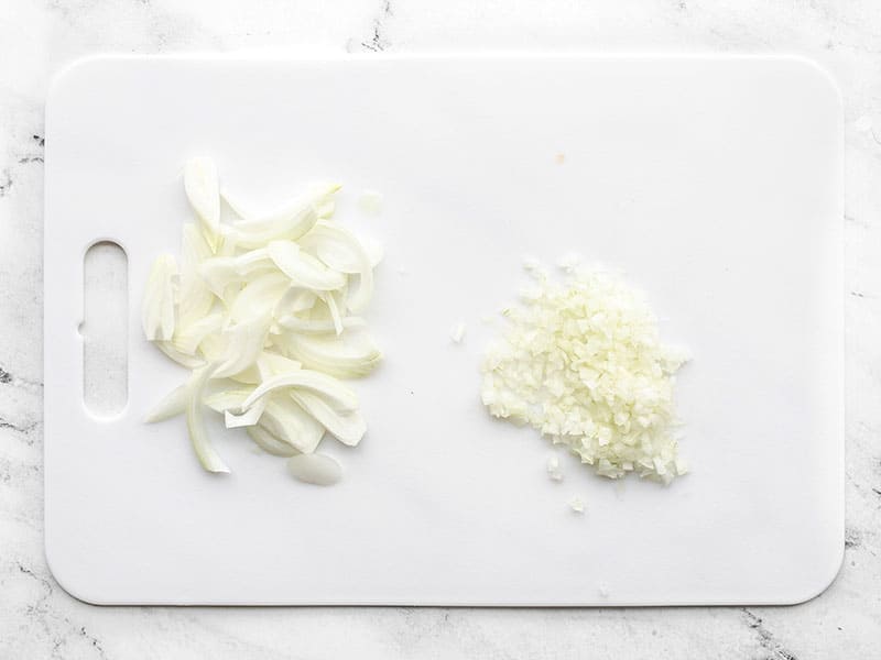 Sliced and minced onion on a cutting board