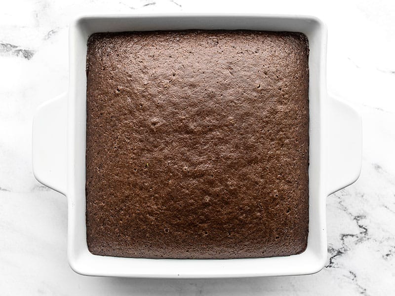 baked chocolate cake in the white square baking dish