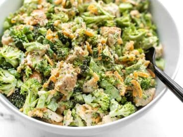 Close up side view of a bowl of Broccoli Cheddar Chicken Salad