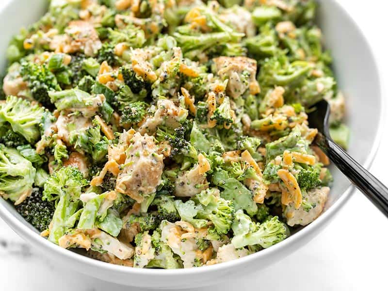 Close up side view of a bowl of Broccoli Cheddar Chicken Salad