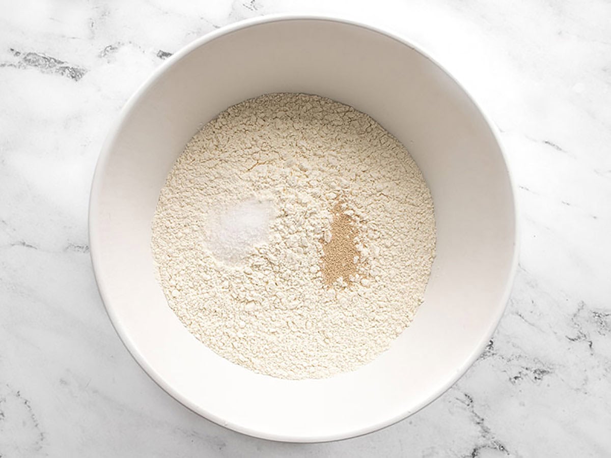 Dry ingredients for focaccia bread in a mixing bowl.