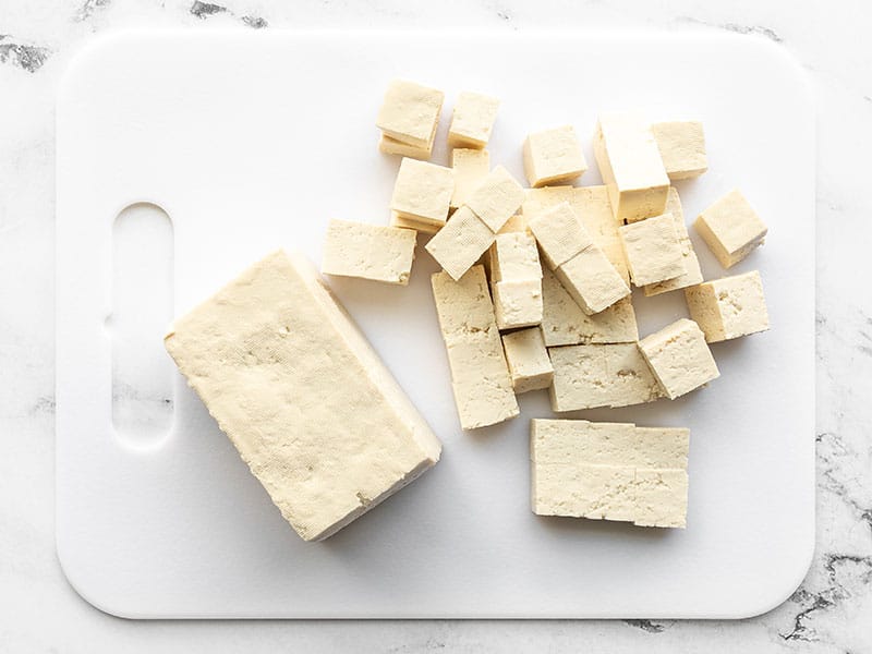 cubed tofu on a cutting board