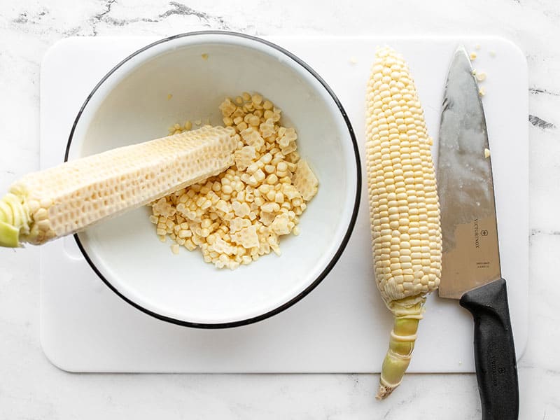 Cutting corn off the cob