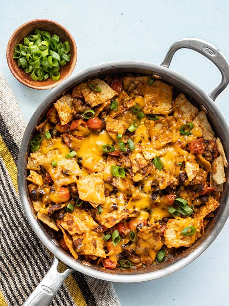 Beef Taco Skillet viewed from above, bowl of green onions on the side