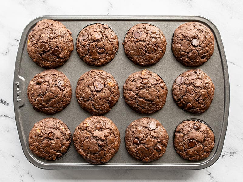 Baked chocolate banana muffins in the muffin tin