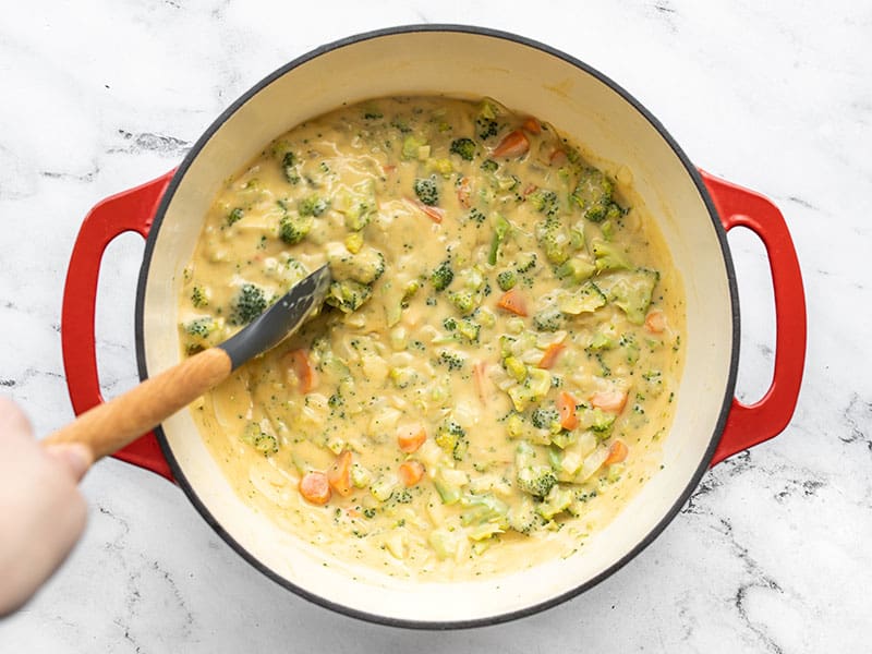 Finished broccoli cheddar soup being stirred