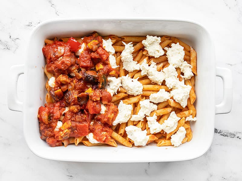 Layer one of baked penne in the casserole dish