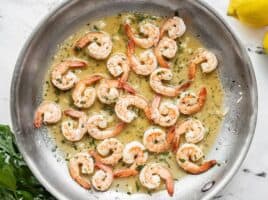 Close up of garlic butter shrimp in the skillet