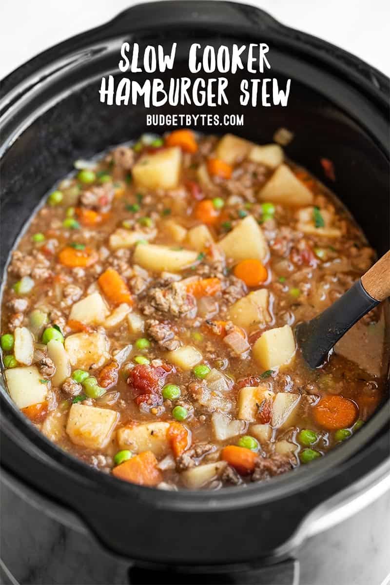 side view of hamburger stew in the slow cooker, title text at the top