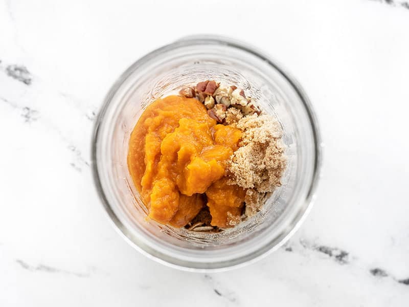 pumpkin puree and brown sugar added to the jar