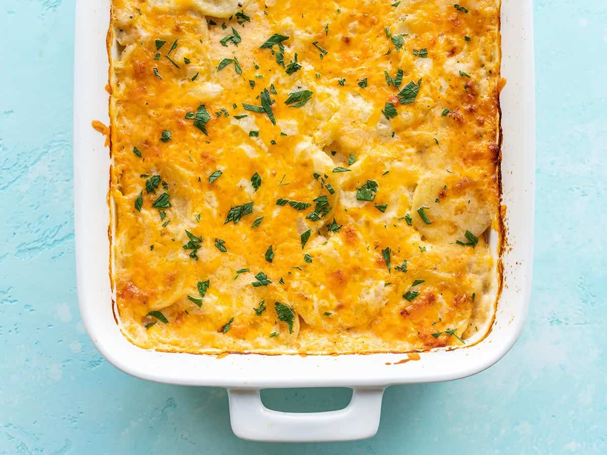 Overhead view of a casserole dish full of freshly baked potatoes au gratin.