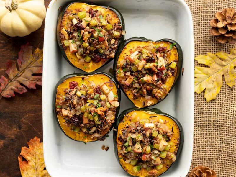 Stuffed acorn squash in a casserole dish, from above