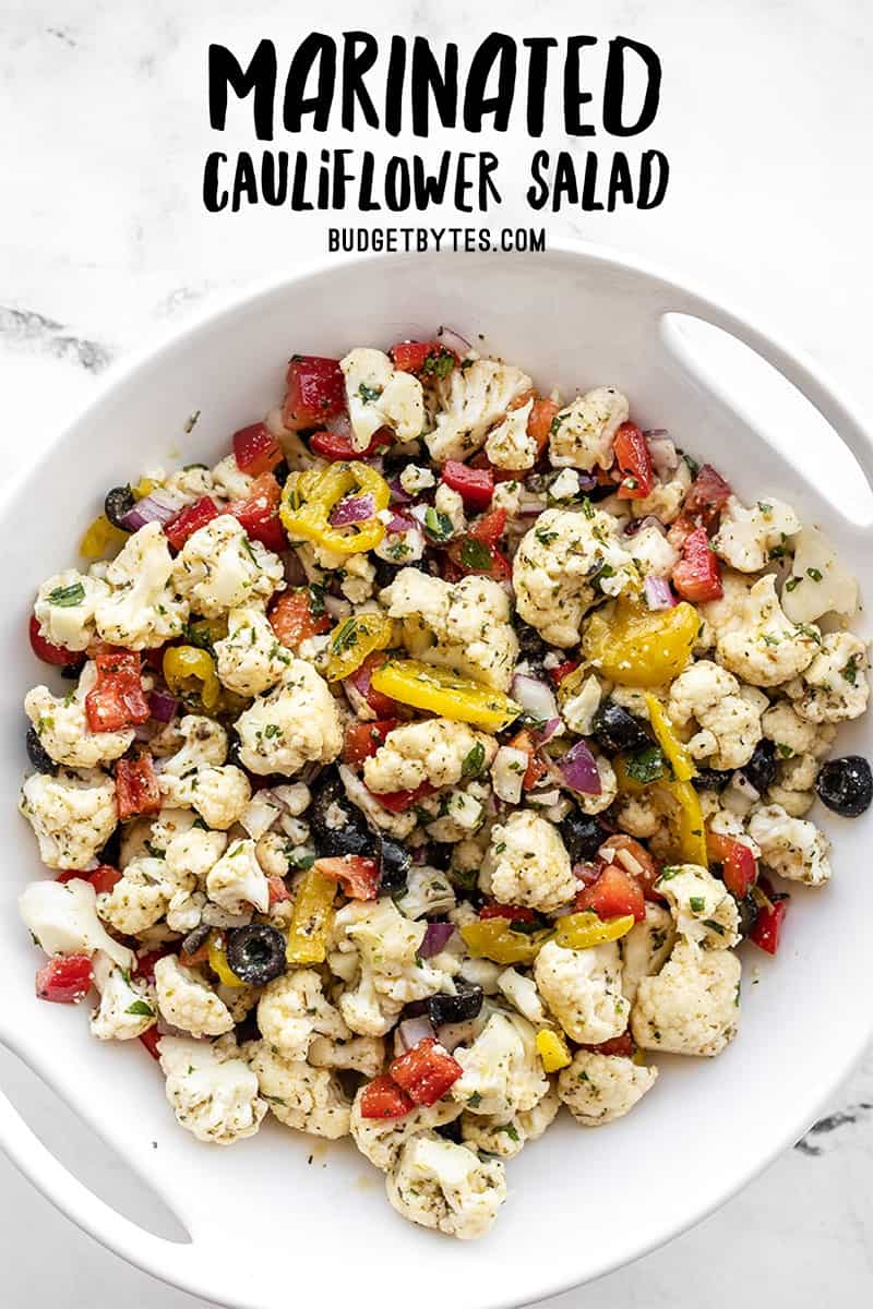 Overhead view of marinated cauliflower salad with title text at the top