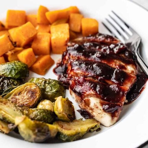 Sheet Pan Cranberry Chicken Dinner on a plate, viewed from the side