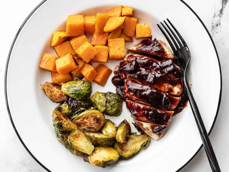 Cranberry Chicken Dinner on a plate with a black fork