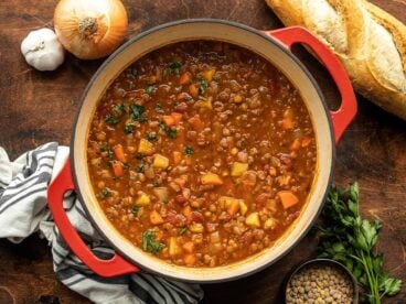 Overhead view of a pot full of tomato lentil soup