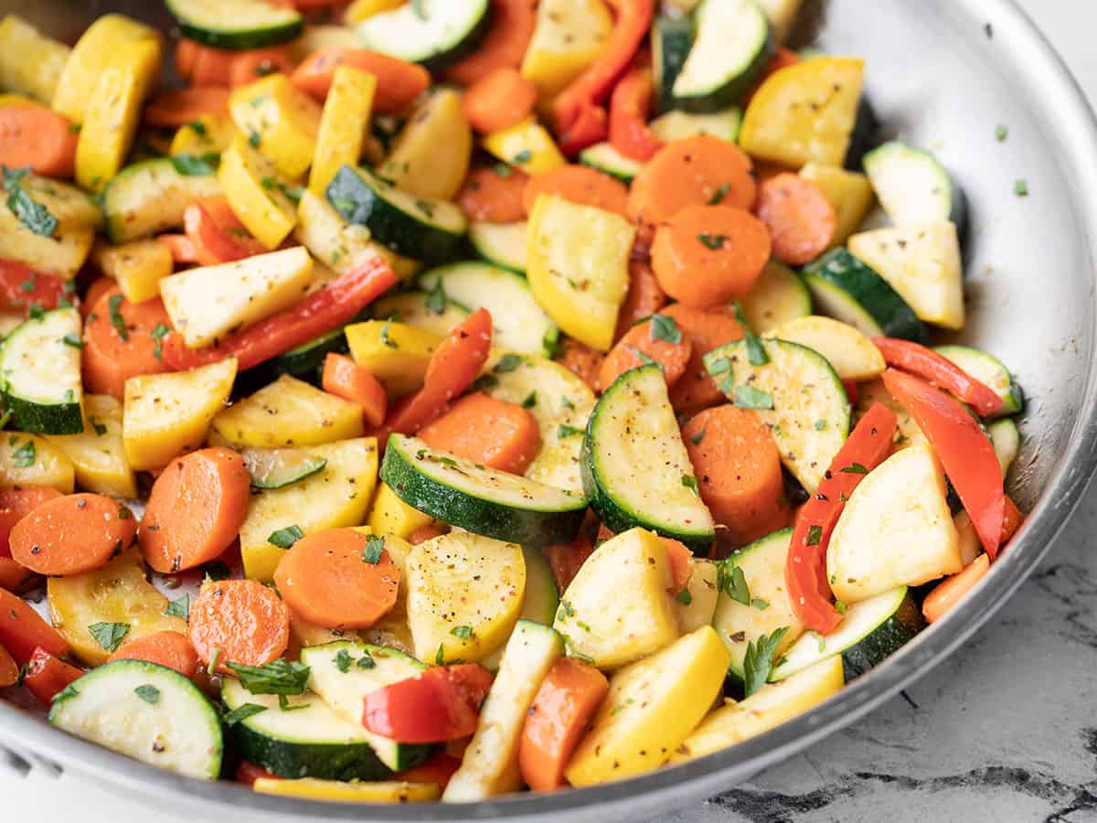 Side view of sautéed vegetables in the skillet