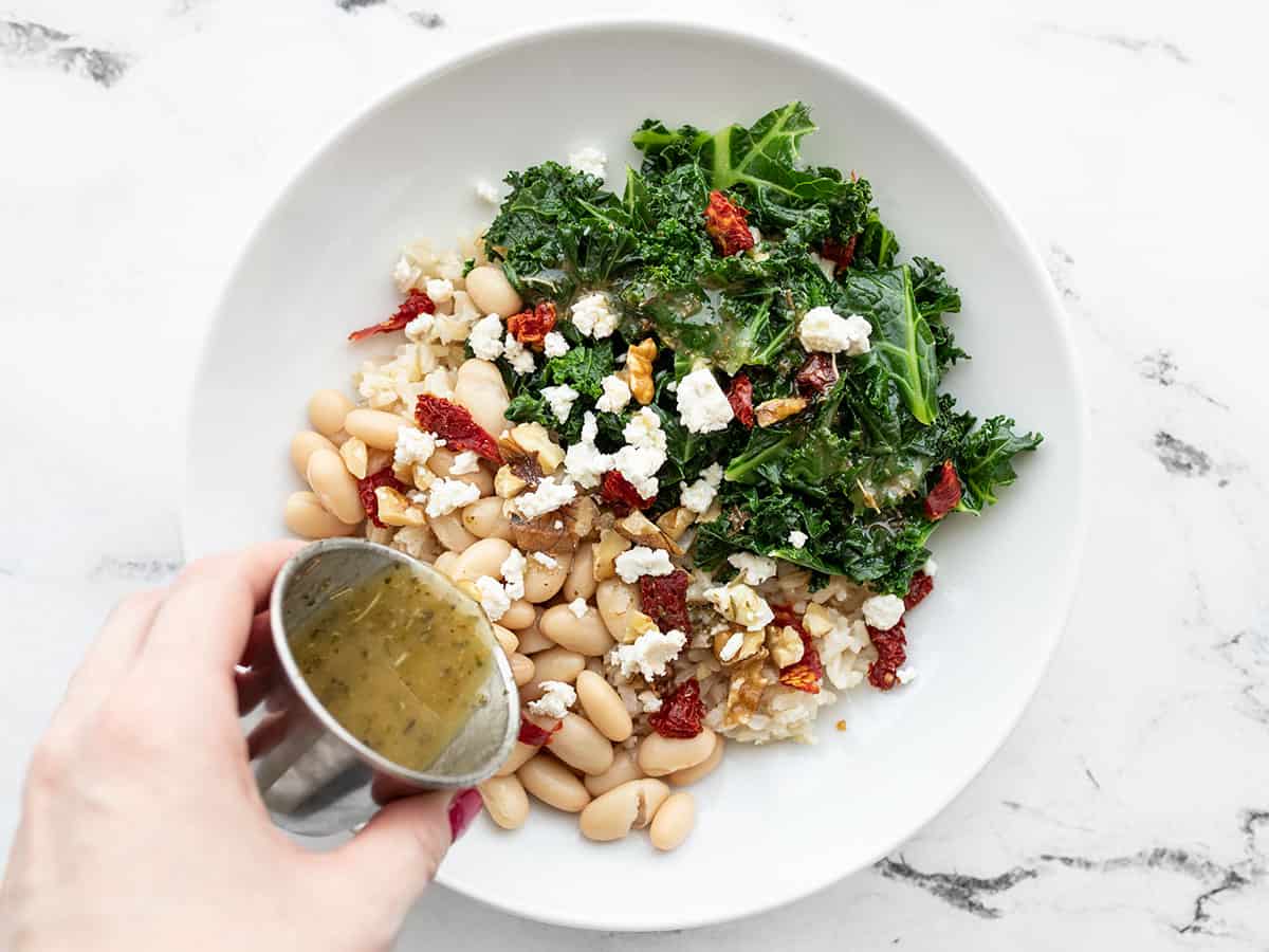 Sun dried tomatoes, walnuts, feta, and dressing added to the power bowl