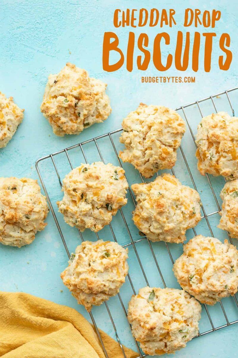 Cheddar drop biscuits on a cooling rack, title text at the top