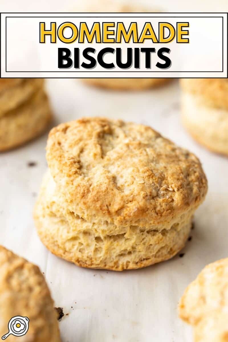 Close up of homemade biscuits on a baking sheet.