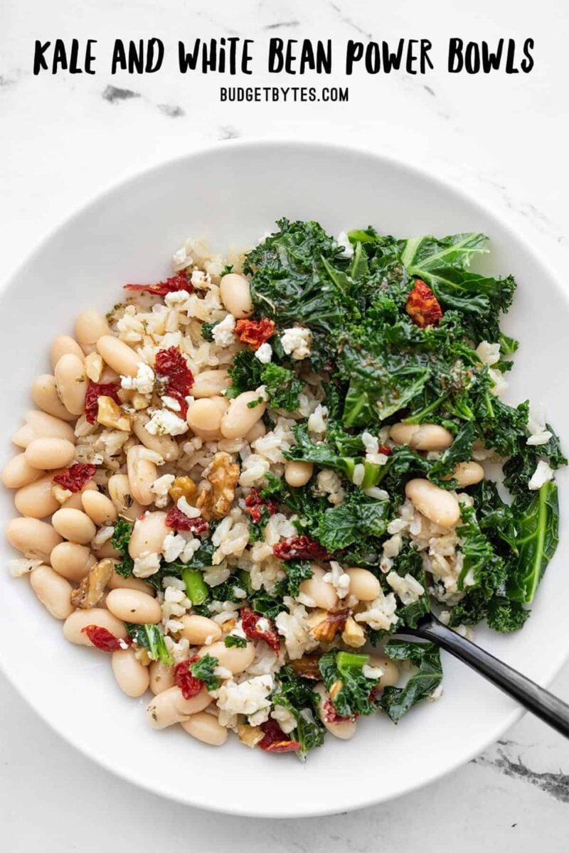 Overhead view of a Kale and White Bean Power Bowl, title text at the top