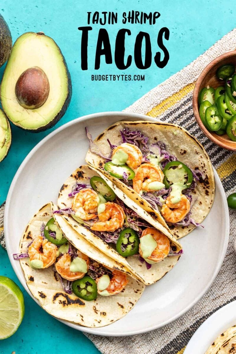 Three Tajín Shrimp Tacos on a plate, title text at the top