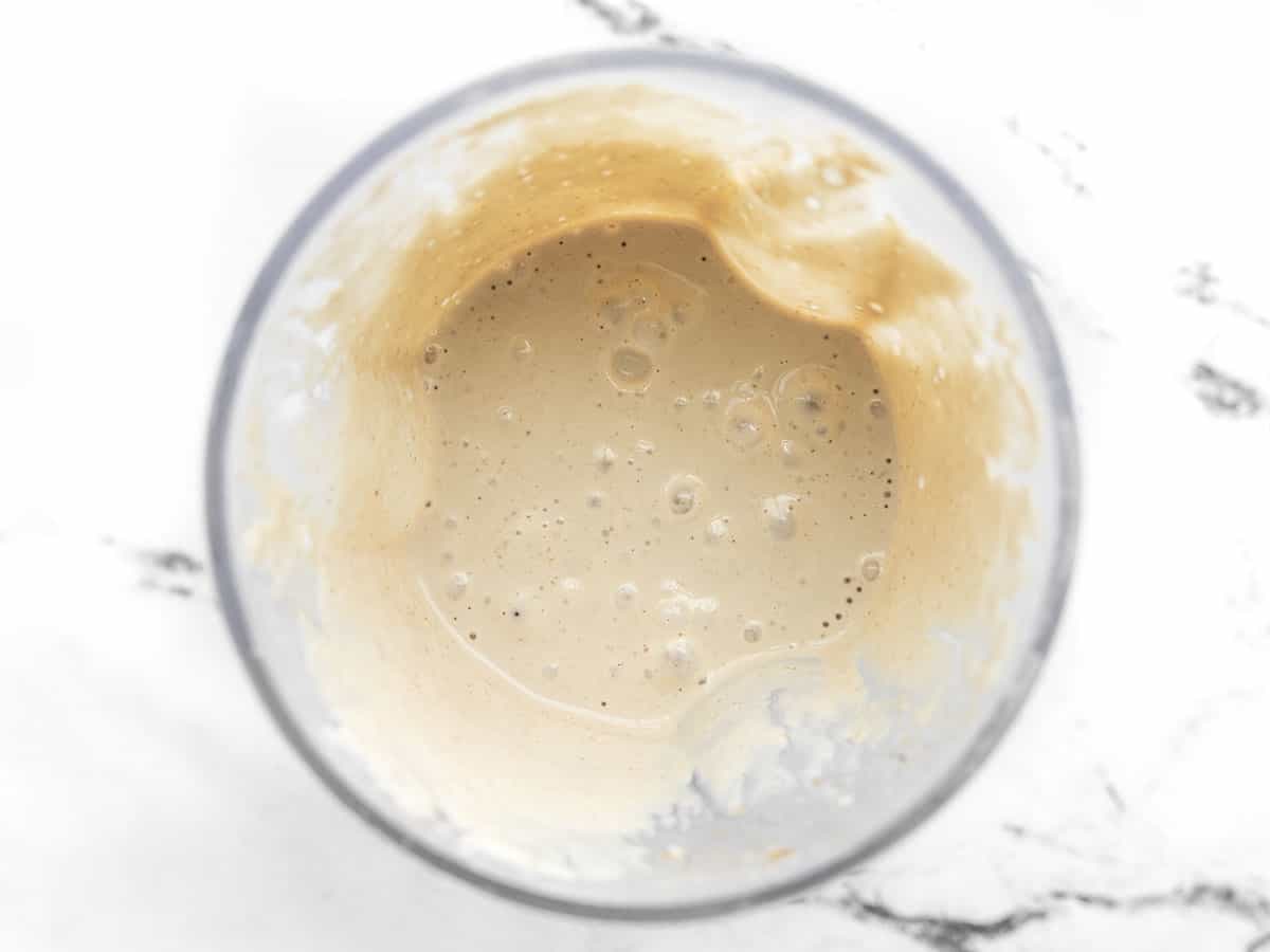 Blended lemon tahini dressing in the blender