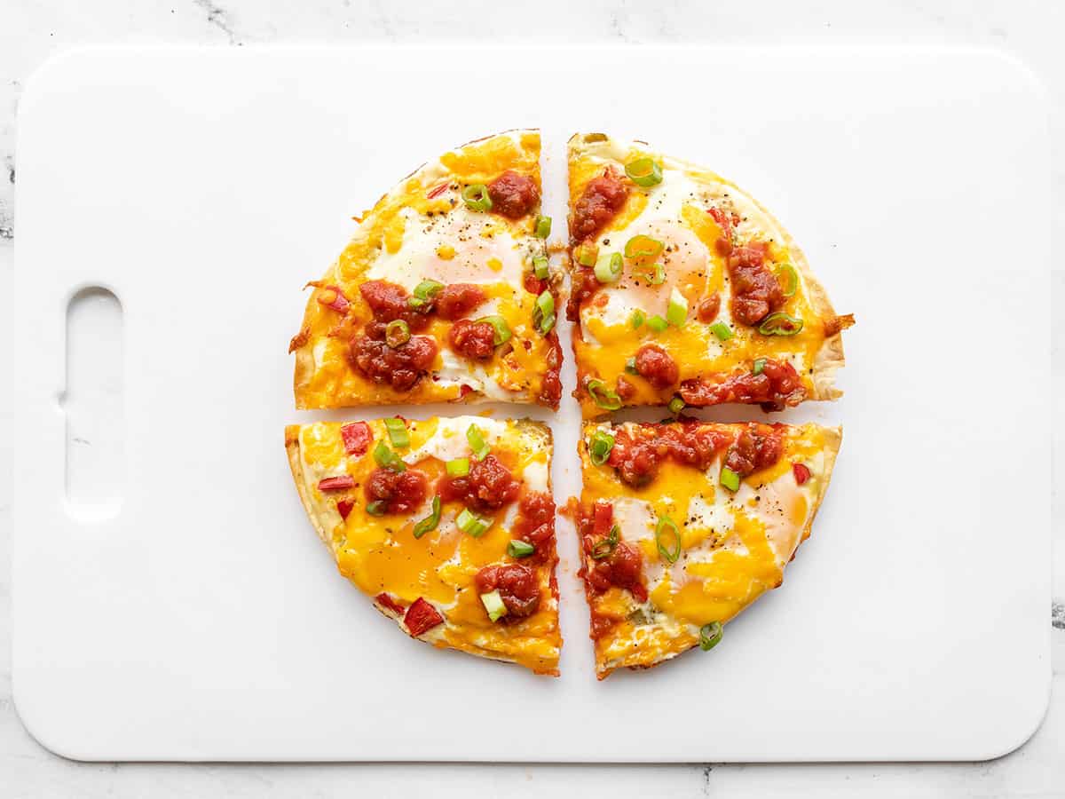 Sliced tortilla baked eggs on a cutting board