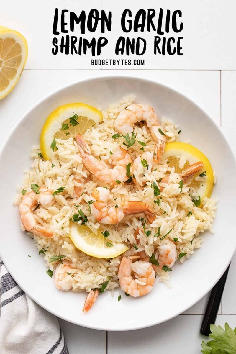 shrimp and rice in a serving bowl with title text at the top