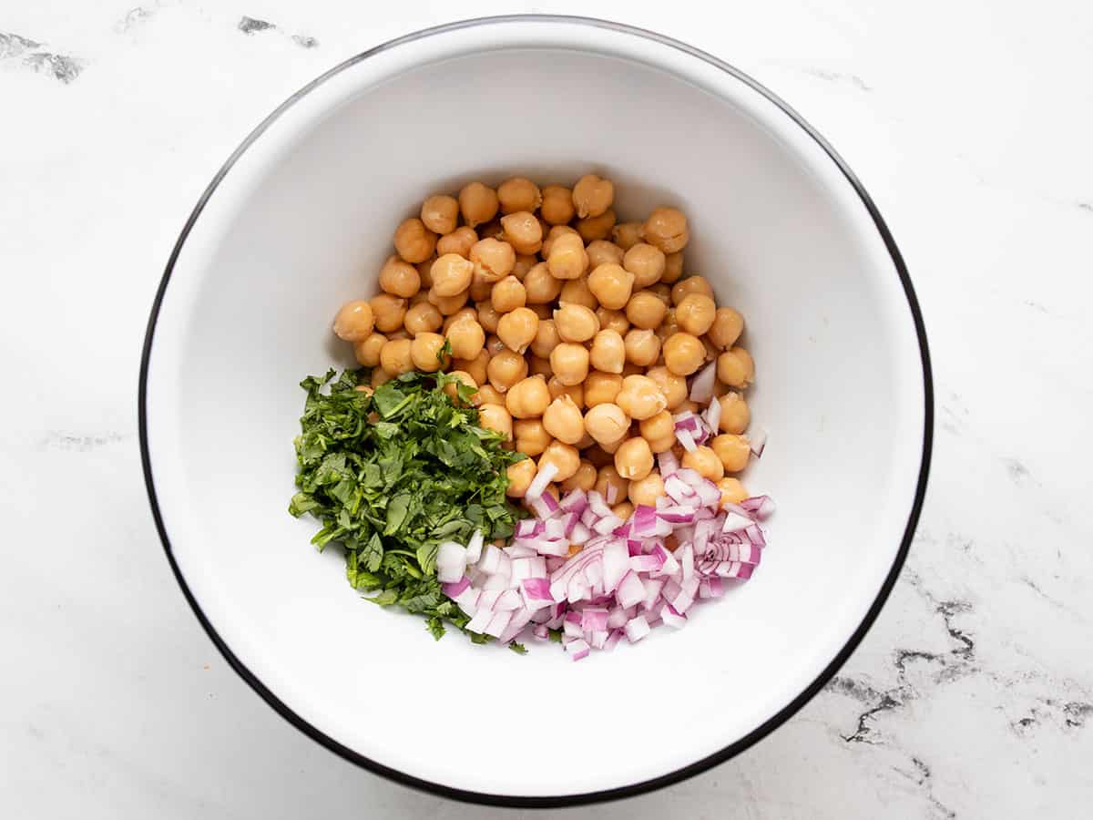 Chickpeas, onions, and cilantro in a bowl