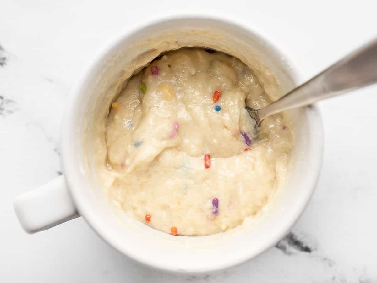 uncooked funfetti mug cake batter in the mug