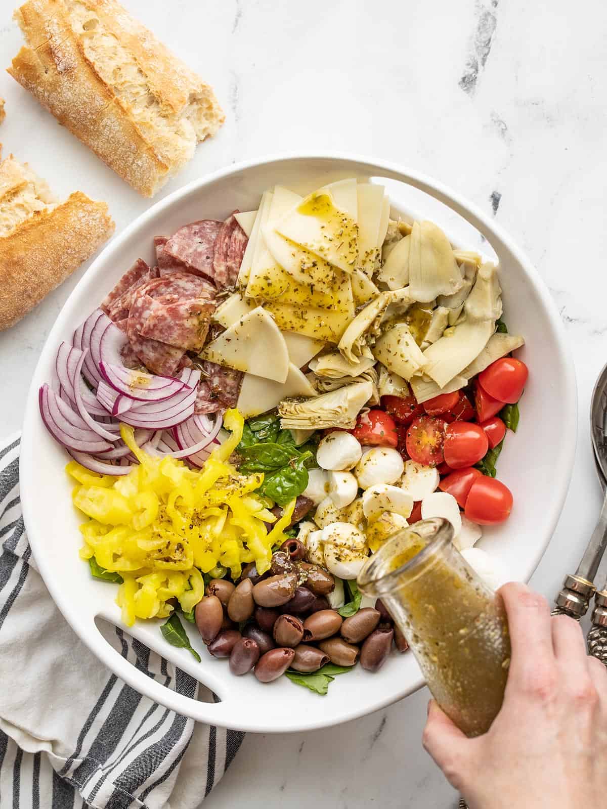 dressing be poured over a serving dish full of antipasto salad