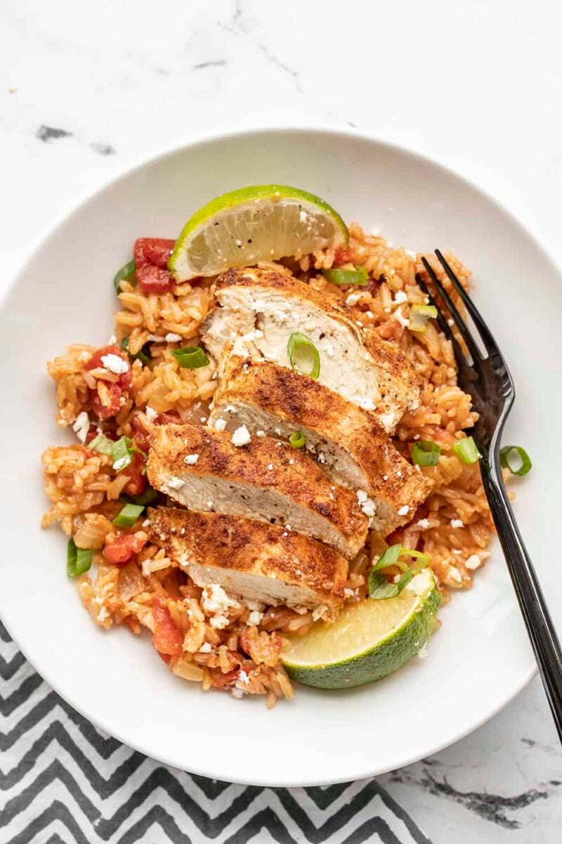 Chipotle lime chicken and rice in a bowl with a fork