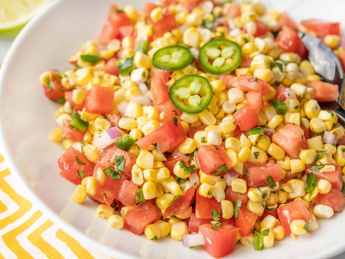 Close up shot of fresh corn salsa from the side