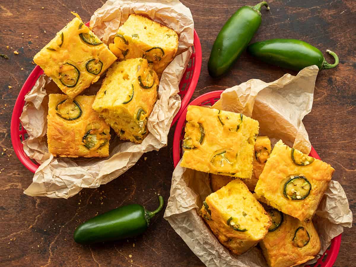 Two baskets full of jalapeño Cornbread pieces