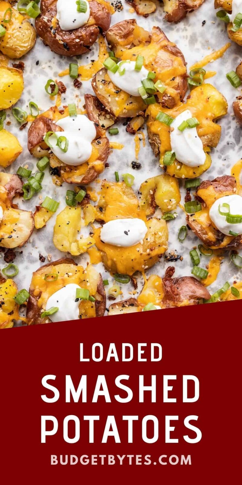 close up of loaded smashed potatoes on a baking sheet, title text at the bottom