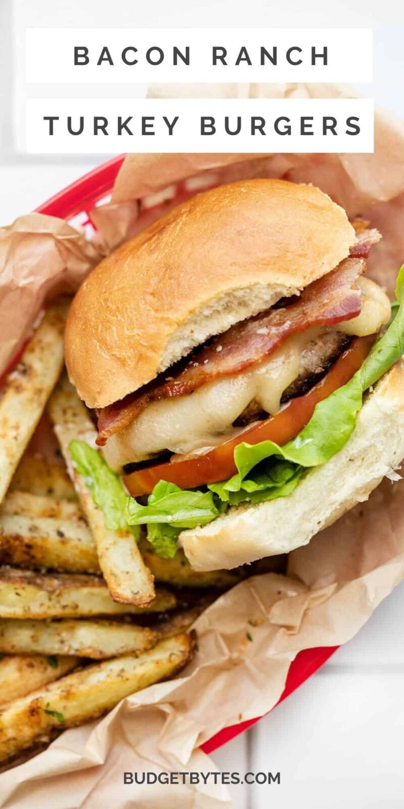 a bacon ranch turkey burger in a basket with fries