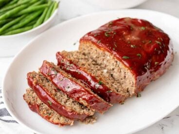 Side view of sliced meatloaf on a platter